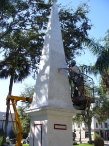 Antwa lime washing the monument